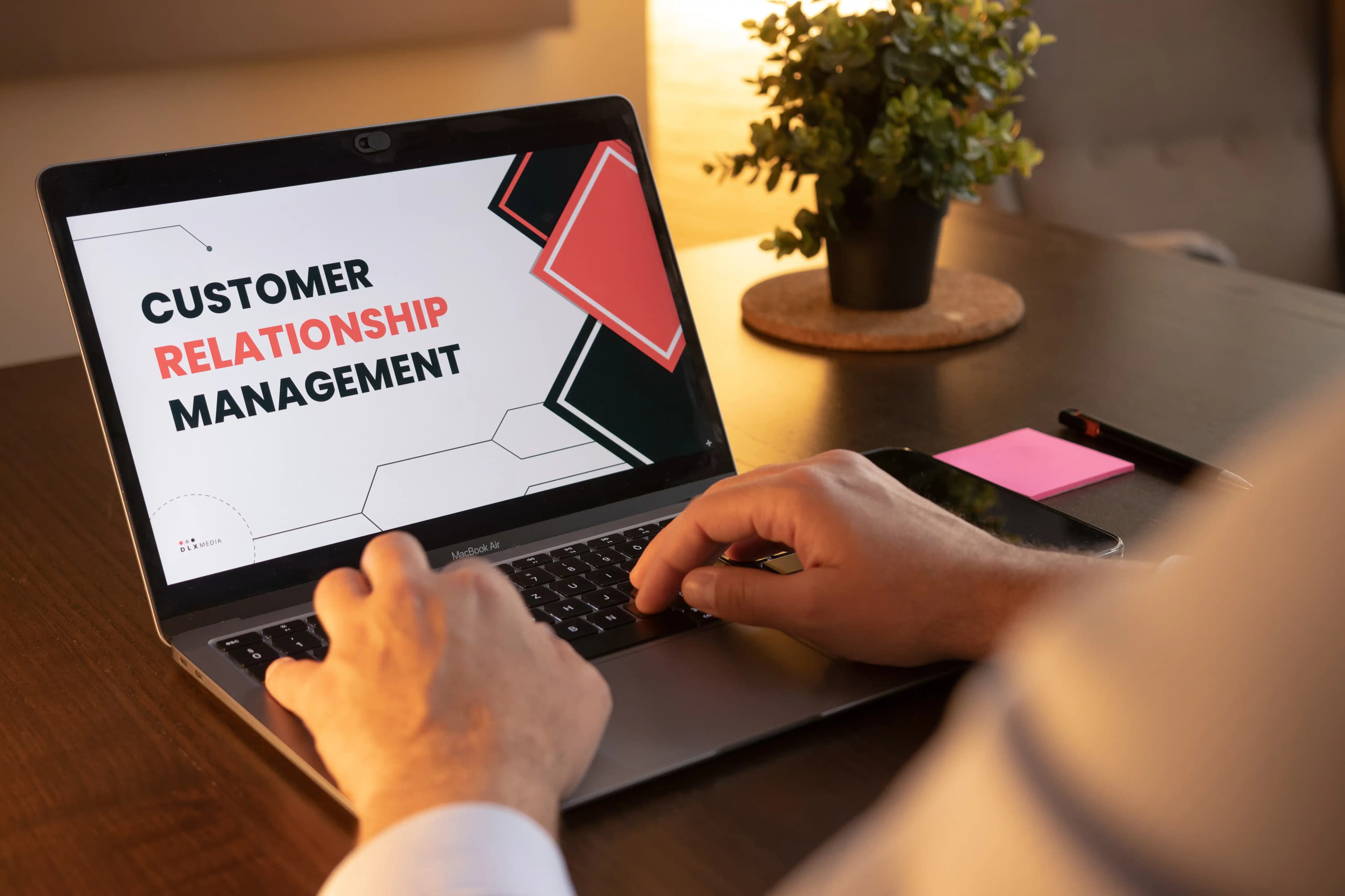A laptop screen that says customer relationship management.