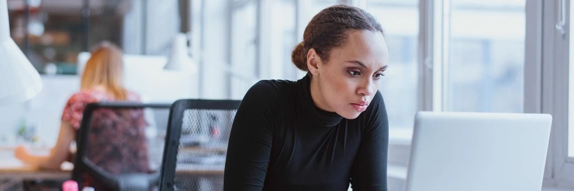 Woman looking into her tech stack options.